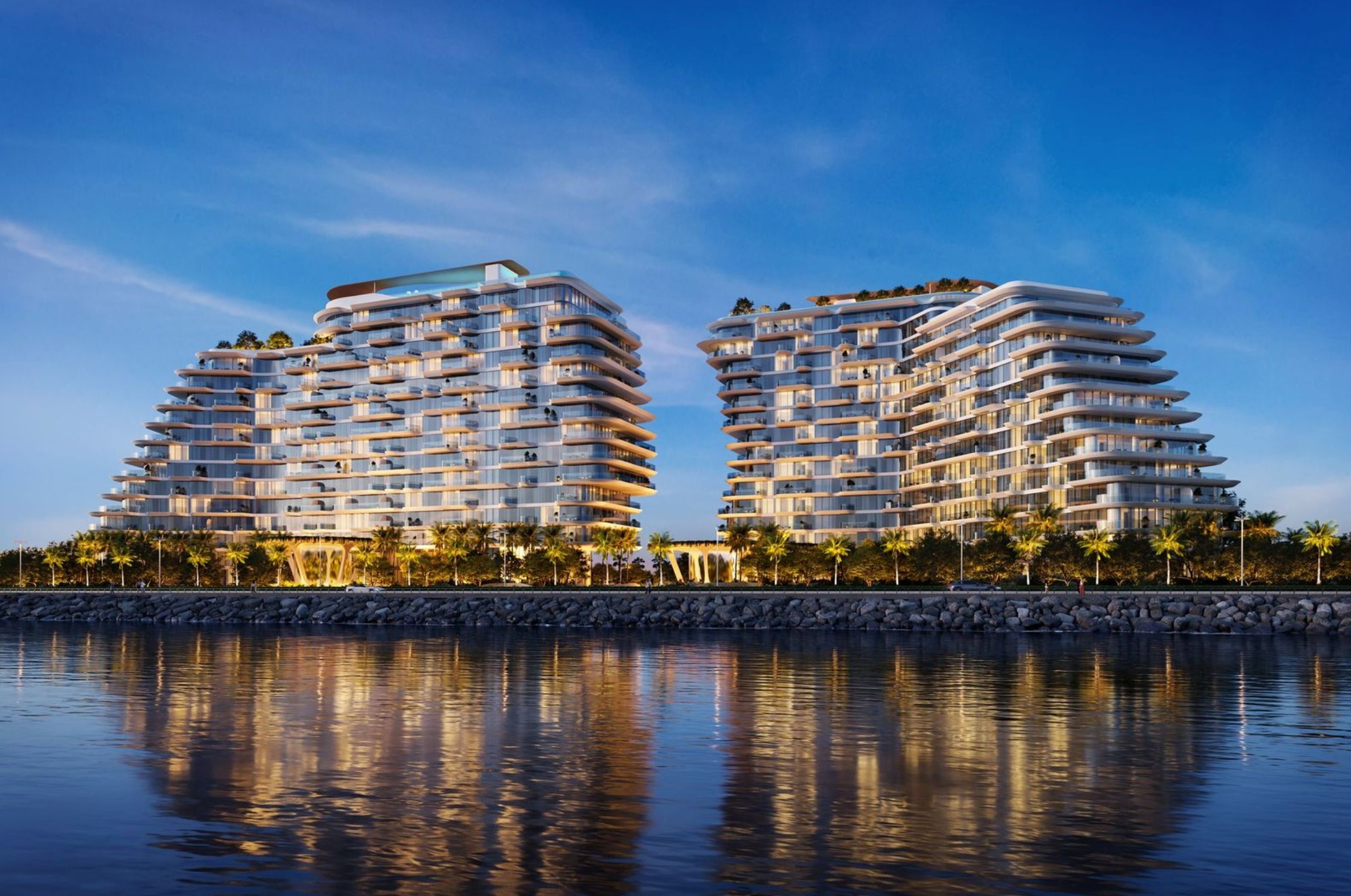 PASSO by BEYOND sculptural beachfront towers on Palm Jumeirah Dubai with waterfront reflections